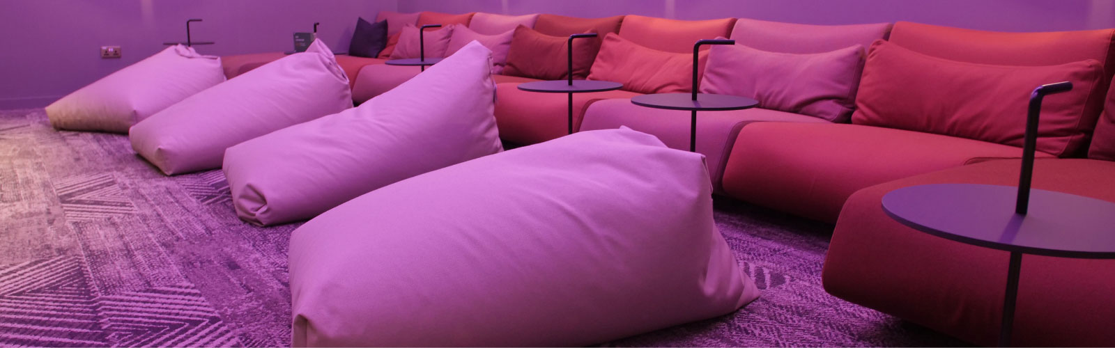 relaxing lounge in office with comfortable seating and bean bags