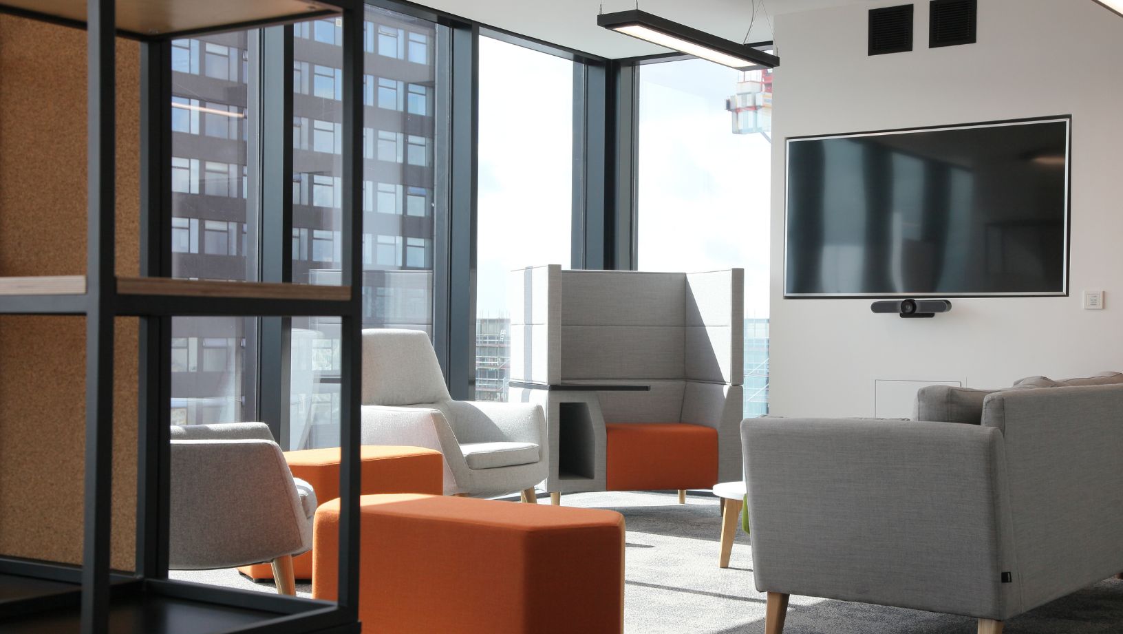 Modern social communal space in high rise office with comfortable seats
