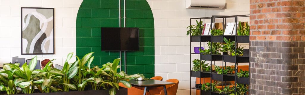 Biophilic exposed brick modern office