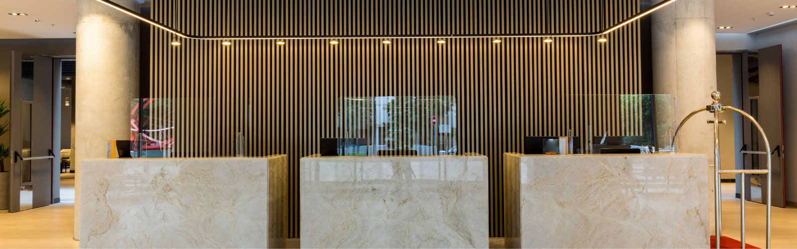 Sneeze guards and protective screens at office reception area