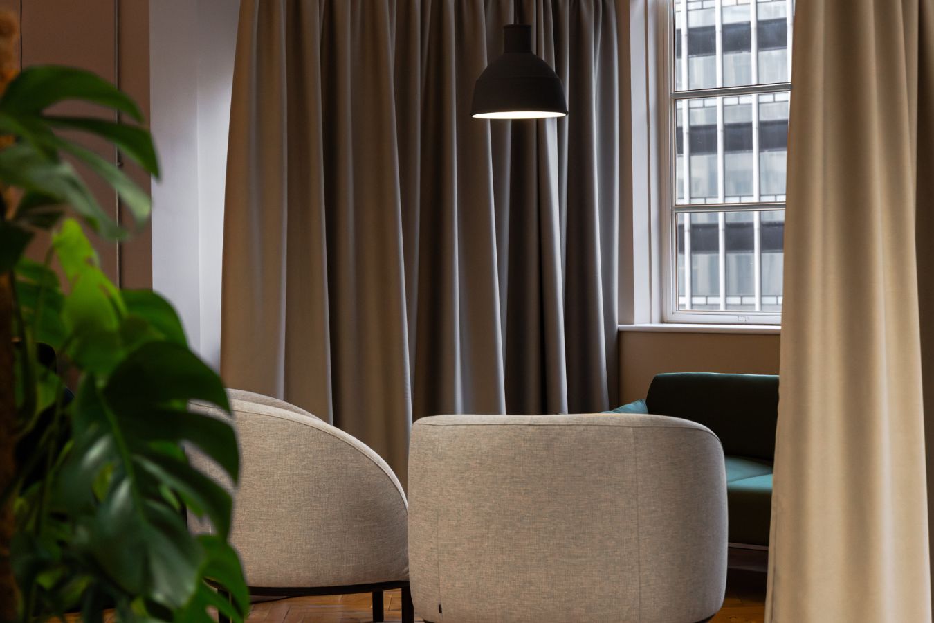 Biophilic private office seating area with sofas